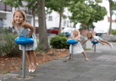 Children playing on the sidewalk